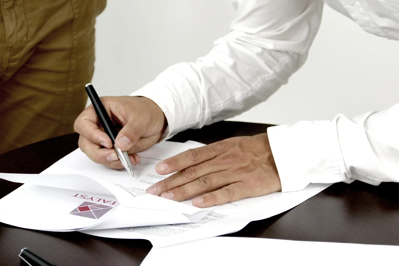firm, contract, person signing a document, firm, contract, contract, contract, contract, contract. Brand Deal Contract Clauses You Should Not Sign Without Changes